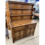 AN ELM ERCOL DRESSER COMPLETE WITH PLATE RACK, 48" WIDE