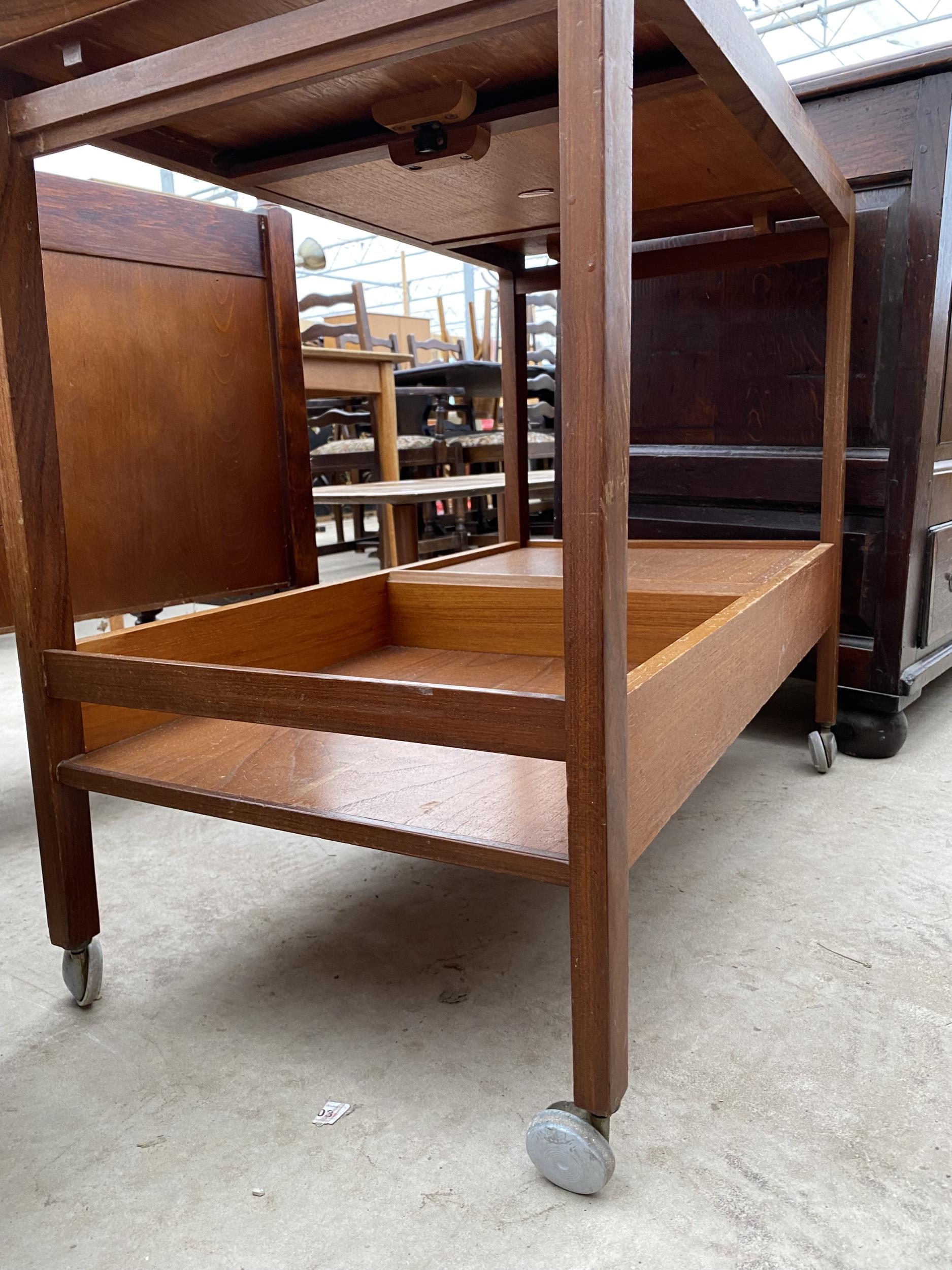 A RETRO TEAK REMPLOY TWO TIER TROLLEY WITH SINGLE DRAWER AND PULL-OUT TOP SECTION, 35X18" - Image 2 of 3