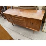 A RETRO TEAK SIDEBOARD ENCLOSING FOUR DRAWERS AND TWO CUPBOARDS, 55" WIDE