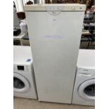 A WHITE WHIRLPOOL UPRIGHT FREEZER