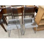 A PAIR OF RETRO PLASTIC KITCHEN CHAIRS ON TUBULAR CHROME FRAMES