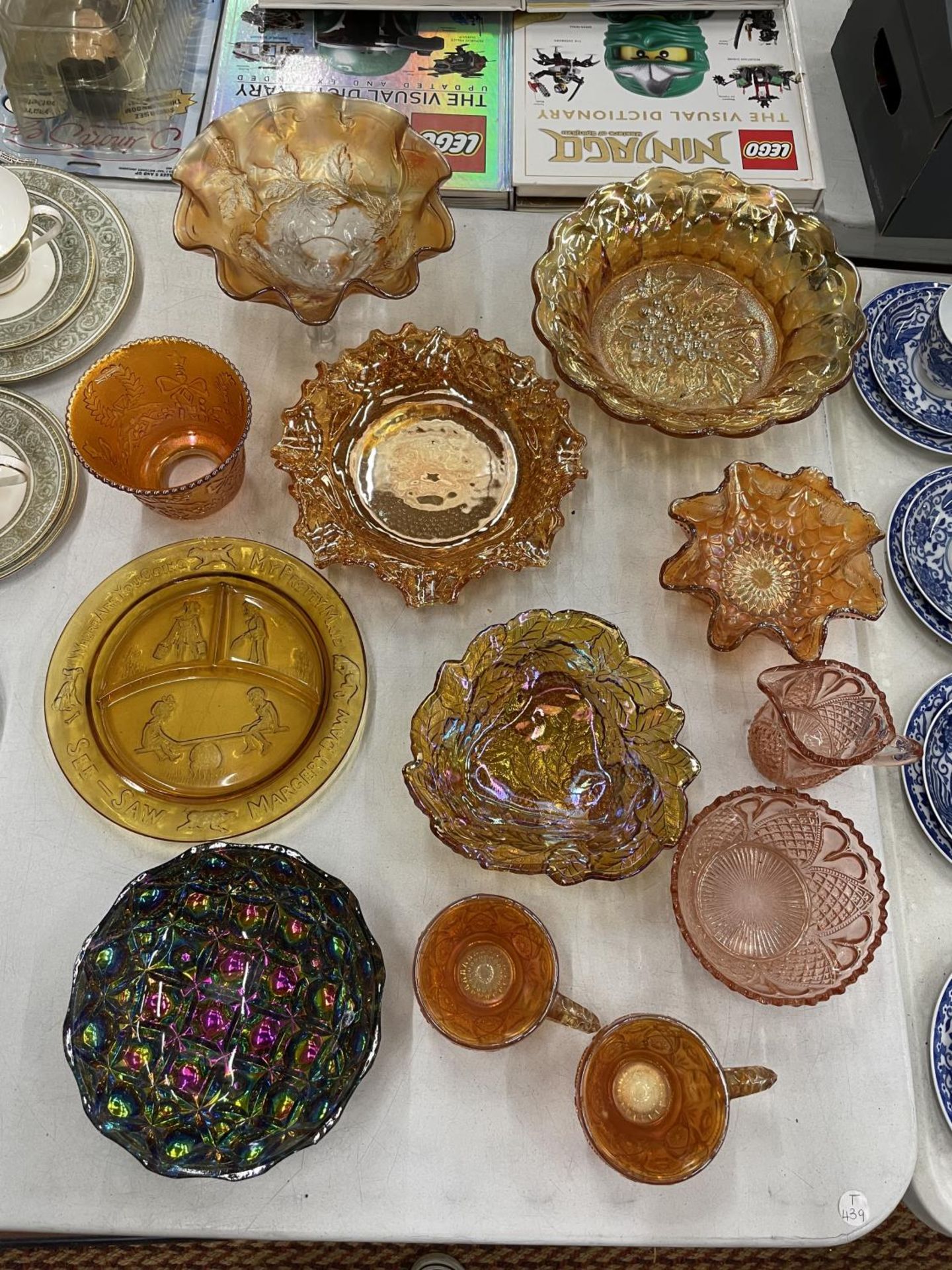 A QUANTITY OF MAINLY AMBER COLOURED CARNIVAL GLASS TO INCLUDE BOWLS, CUPS, ETC