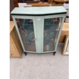 A PAINTED AND GLAZED AND LEADED TWO DOOR DISPLAY CABINET ON CABRIOLE LEGS, 36" WIDE