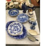A QUANTITY OF ANTIQUE BLUE AND WHITE POTTERY TO INCLUDE FLOW BLUE EXAMPLES, MOSTLY UNMARKED