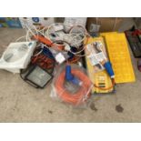 A LARGE ASSORTMENT OF ITEMS TO INCLUDE PLASTIC CAR RAMPS, EXTENSION LEADS AND ELECTRIC CABLES ETC