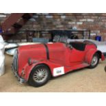 A LARGE MODEL OF A RED MORGAN SPORTS CAR LENGTH 36CM