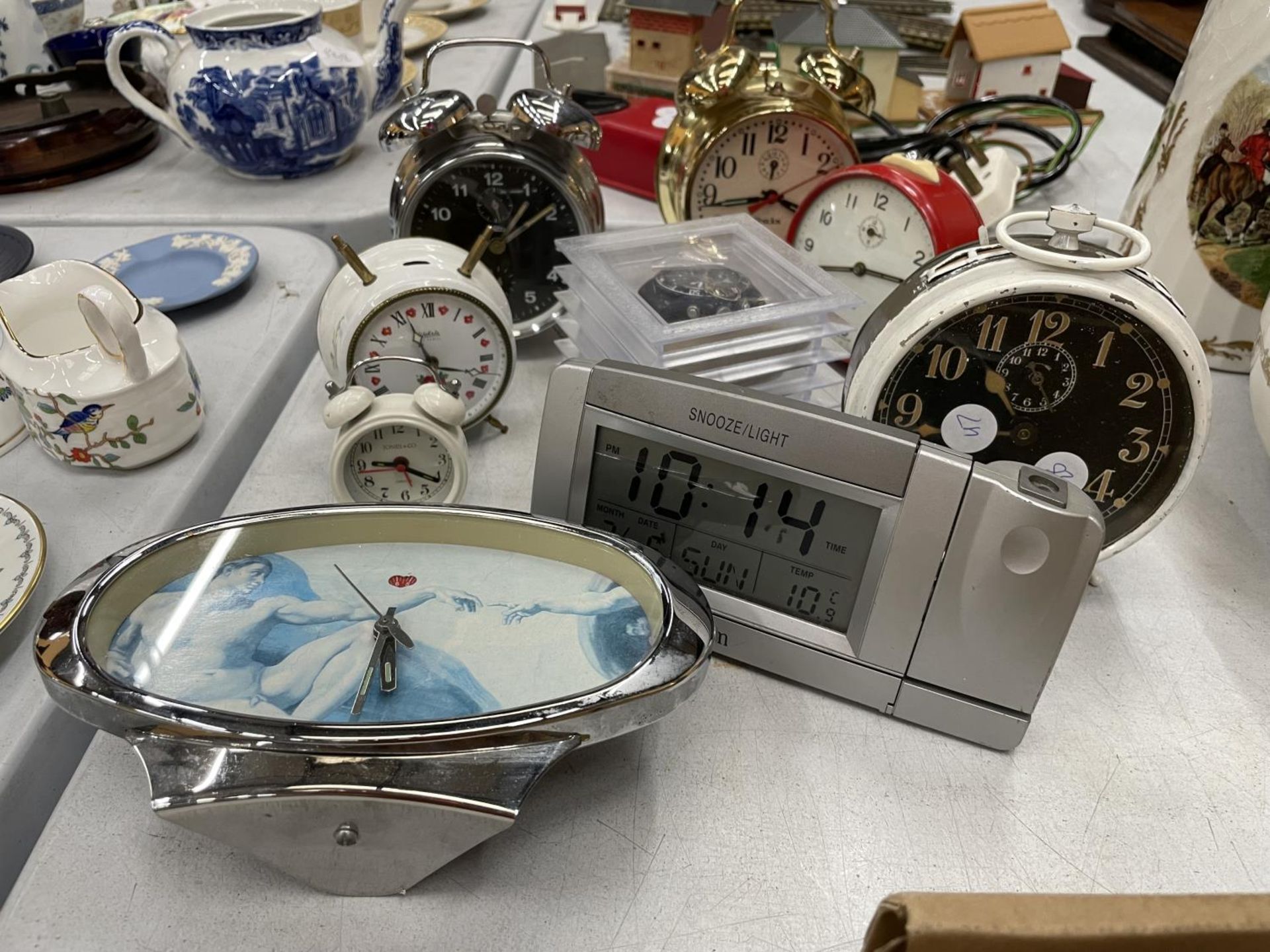 A QUANTITY OF ALARM CLOCKS PLUS A DETOMASO WATCH