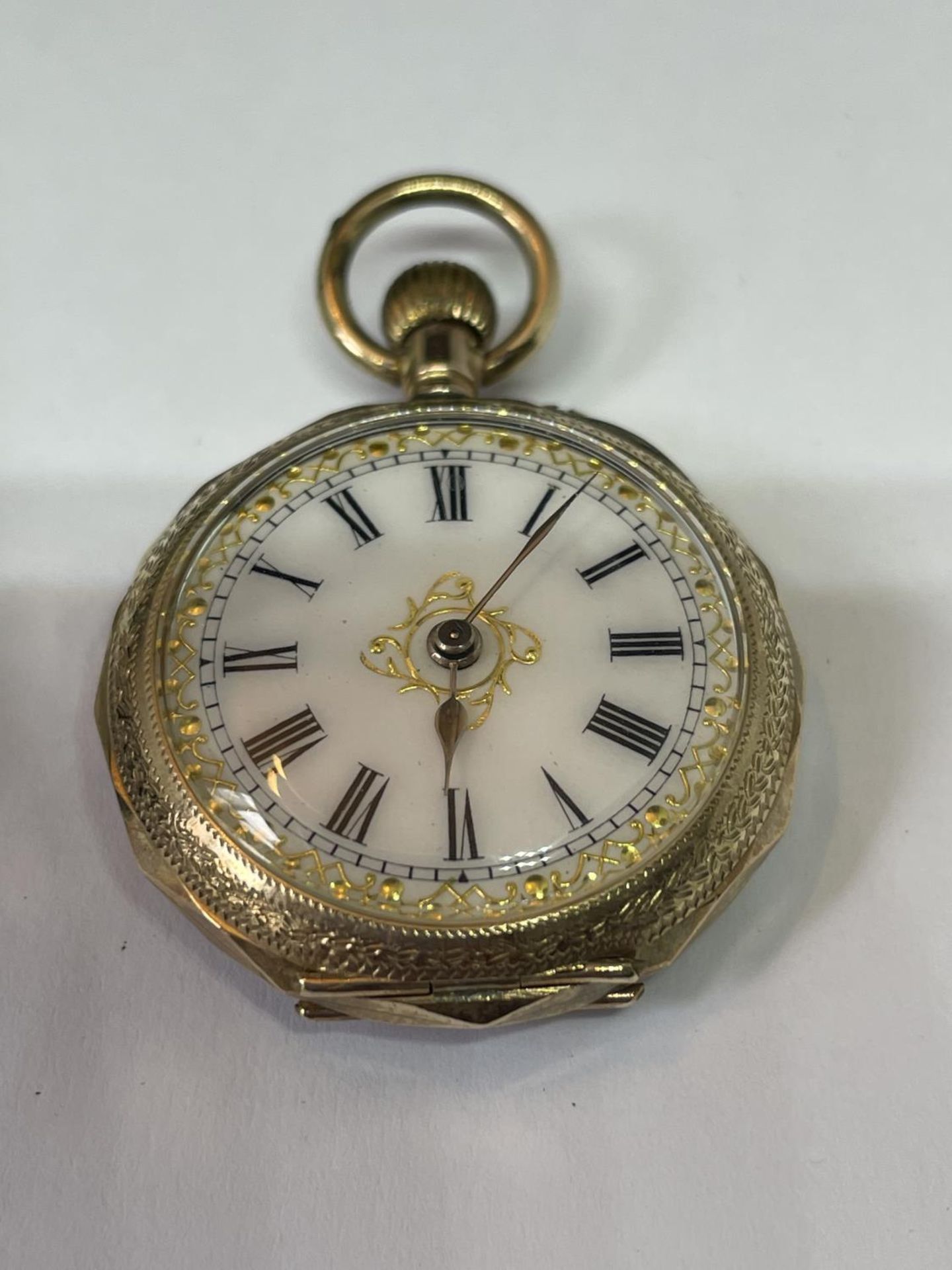 A 9 CARAT GOLD MARKED 9K LADIES POCKET WATCH SEEN WORKING BUT NO WARRANTY IN A PRESENTATION BOX