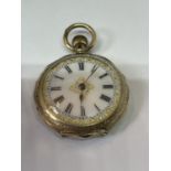 A 9 CARAT GOLD MARKED 9K LADIES POCKET WATCH SEEN WORKING BUT NO WARRANTY IN A PRESENTATION BOX