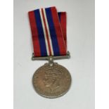 A WWII MEDAL WITH RIBBON