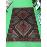 A 100% HAND KNOTTED WOOLLEN BALUCHI RUG SIZE 135CM X 93CM