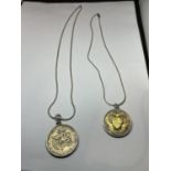 TWO MARKED SILVER CHAINS WITH PENDANTS TO INCLUDE A 1964 HALF DOLLAR AND A FURTHER MEDAL