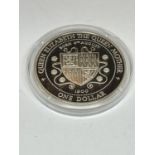 A SILVER PROOF ONE DOLLAR COIN IN A CAPSULE