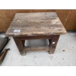 A SMALL VINTAGE WOODEN STOOL