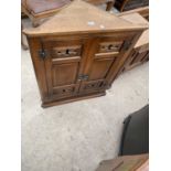 A REPRODUCTION GOTHIC OAK CORNER CUPBOARD WITH SHAPED INTERIOR SHELVES, 27" WIDE