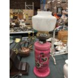 A LARGE PINK AND FLORAL OIL LAMP WITH SHADE AND CHIMNEY A/F APPROX 60CM HEIGHT