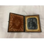 A VICTORIAN LEATHER CASED GLASS PHOTOGRAPH