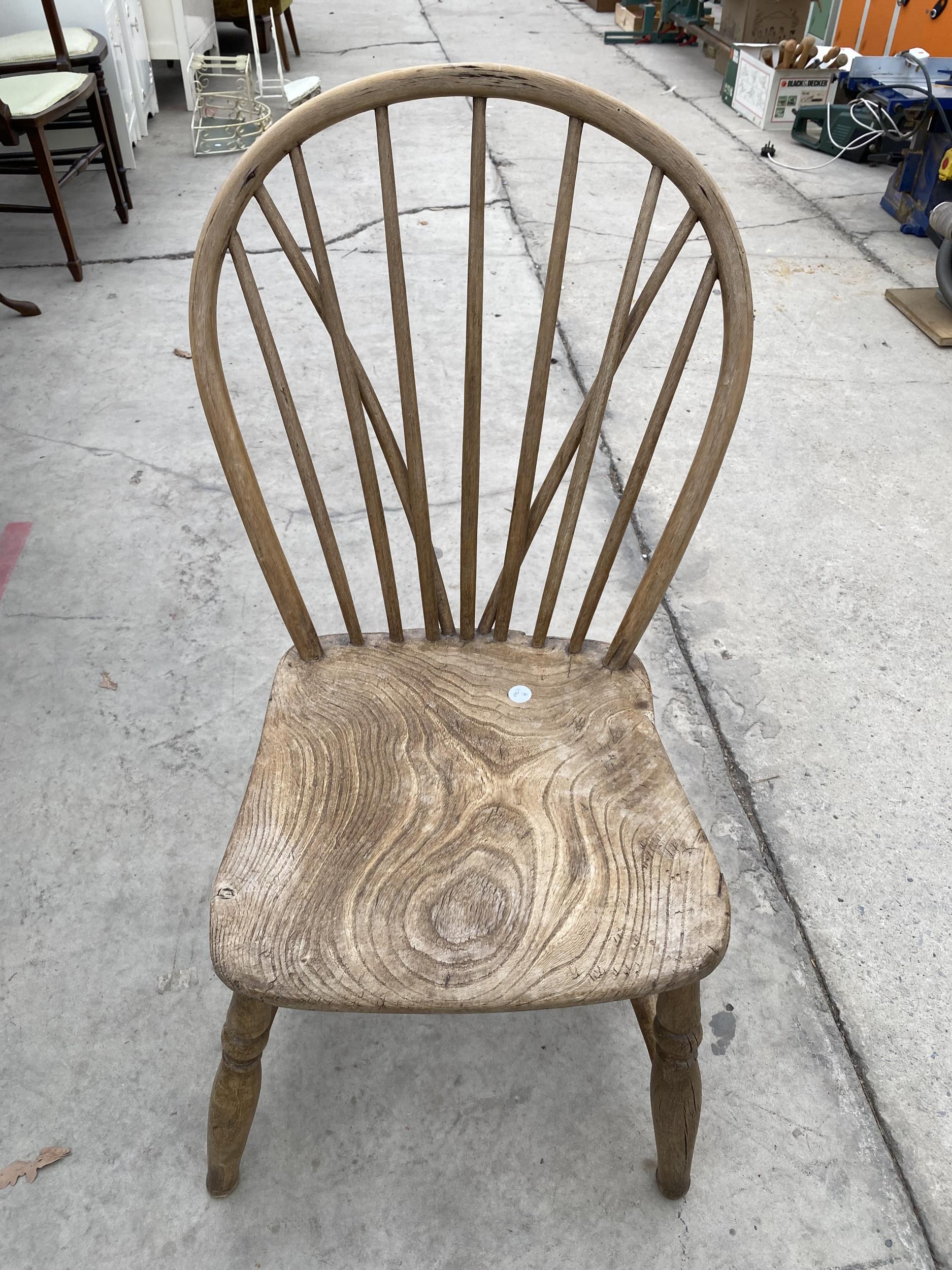 A CHILDS ELM AND BEECH WINDSOR STYLE CHAIR