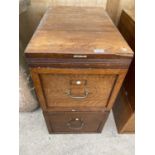 A VINTAGE WOODEN TWO DRAWER INTERLOCKING FILING CABINET