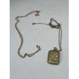 A 9 CARAT GOLD LOCKET ON A CHAIN WITH A FURTHER CHAIN GROSS WEIGHT 4.3 GRAMS