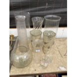 A LARGE ASSORTMENT OF GLASS VASES