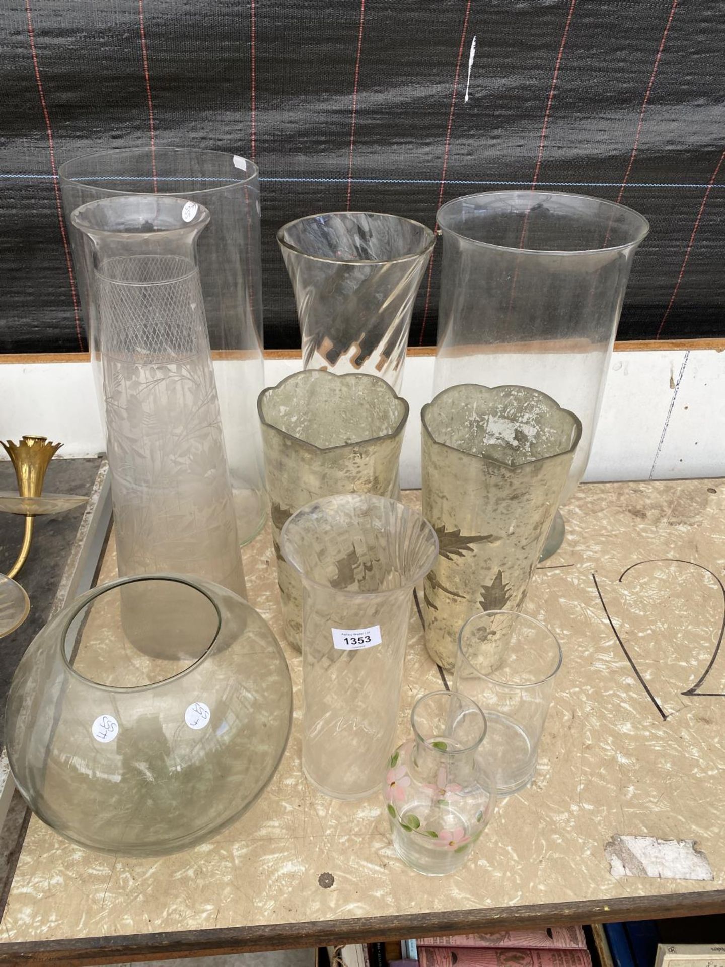 A LARGE ASSORTMENT OF GLASS VASES