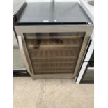 A BLACK AND CHROME WINE BOTTLE FRIDGE