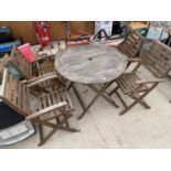 A TEAK ROYALCRAFT GARDEN FURNITURE SET COMPRISING OF A ROUND TABLE AND FOUR CHAIRS