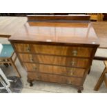 A SHINY WALNUT CHEST OF FOUR DRAWERS ON CABRIOLE LEGS, 32.5" WIDE