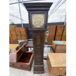 A OAK JACOBEAN STYLE BRASS FACED LONGCASE CLOCK WITH BARLEYTWIST UPRIGHTS