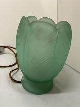 A GREEN GLASS TABLE LAMP IN THE FORM OF AN OPENING FLOWER