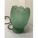 A GREEN GLASS TABLE LAMP IN THE FORM OF AN OPENING FLOWER