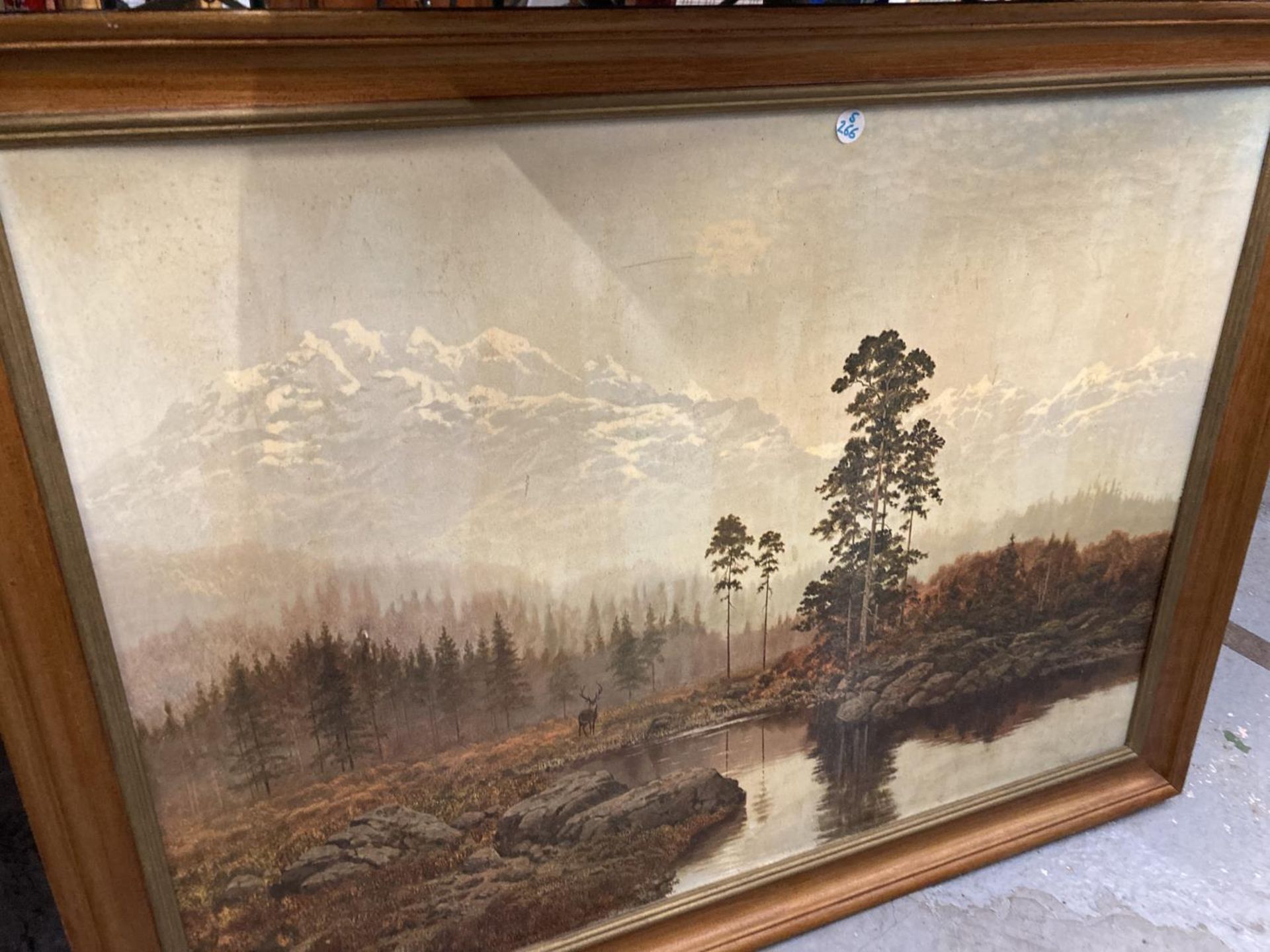 A FRAMED PRINT DEPICTING A LAKE SCENE WITH A STAG AND MOUNTAINOUS BACK DROP - Image 2 of 4