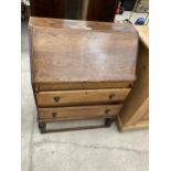 AN EARLY 20TH CENTURY OAK BUREAU, 28.5" WIDE AND A VICTORIAN BOX COMMODE