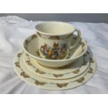 A SET OF FOUR ROYAL DOUKTON BUNNYKINS TABLEWARE TO INCLUDE PLATES, BOWL AND MUG. SECONDS