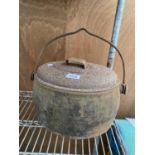 A VINTAGE CAST IRON LIDDED COOKING POT