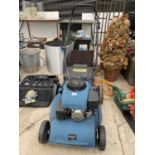 AN EINHELL PETROL LAWN MOWER WITH GRASS BOX