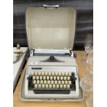 A RETRO ADLER GABRIELE 25 TYPE WRITER STAMPED MADE IN WESTERN GERMANY AND WITH CARRY CASE
