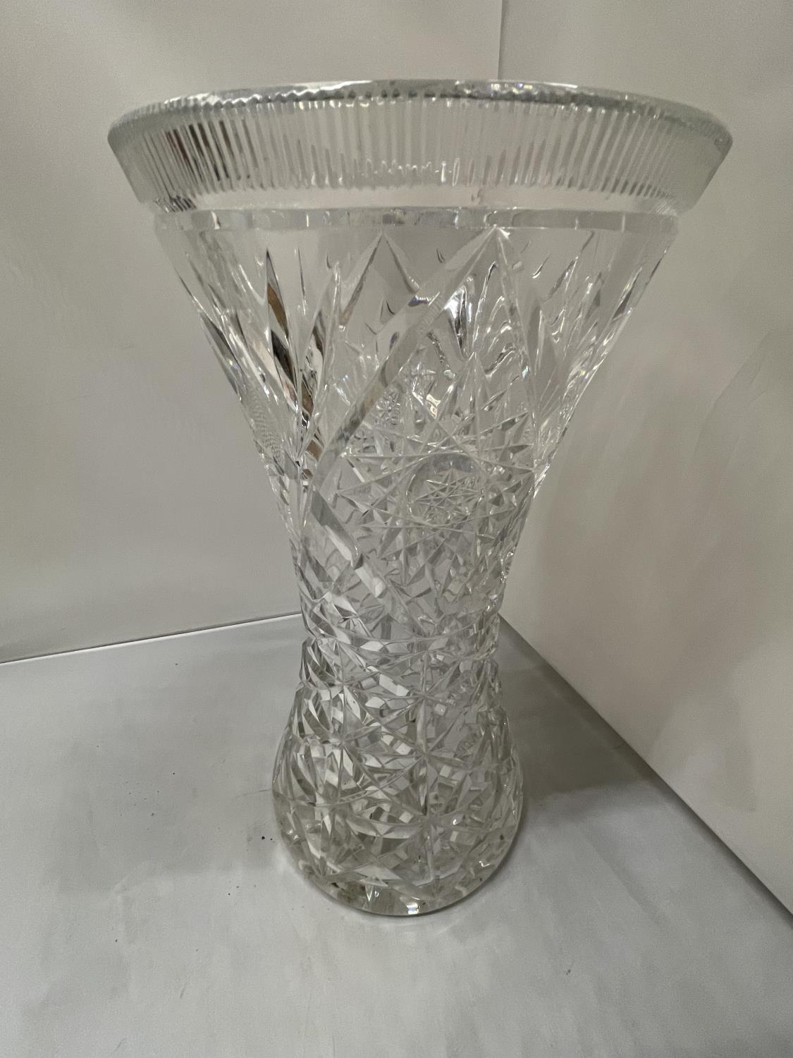 A VERY HEAVY CUT GLASS VASE HEIGHT 37CM