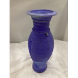 A STONEWARE STUDIO POTTERY VASE IN PURPLES AND GREENS SIGNED SS HEIGHT 32CM