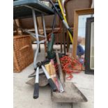 AN ASSORTMENT OF GARDEN TOOLS TO INCLUDE SPADES, A RAKE AND A GRASS TRIMMER ETC