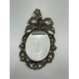 A LARGE DECORATIVE PENDANT WITH A LARGE CLEAR CENTRE STONE SURROUNDED BY DIAMOND CHIPS 6 CM X 3 CM