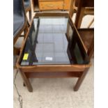 A RETRO TEAK COFFEE TABLE WITH SMOKED GLASS TOP, 34.5X17"