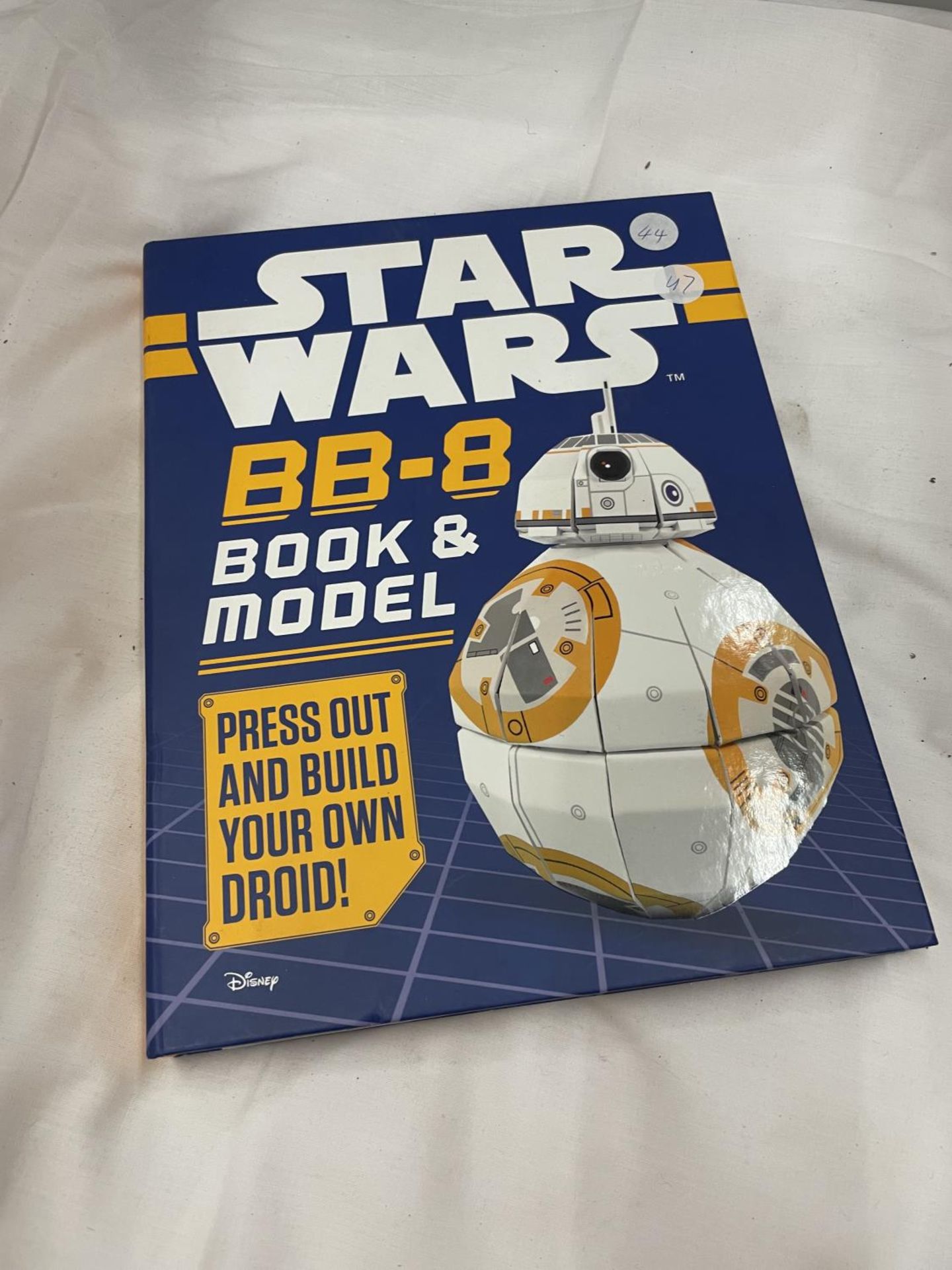 A STAR WARS BB-8 BOOK AND MODEL