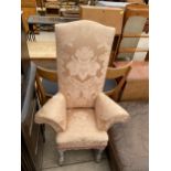A 19TH CENTURY STYLE HIGH BACK UPHOLSTERED CHILDS SIZE CHAIR ON LIMED OAK TURNED LEGS, 25" WIDE