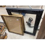 A FRAMED WALL MIRROR AND A GILT PICTURE FRAME