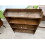 AN OPEN OAK FOUR TIER BOOKCASE