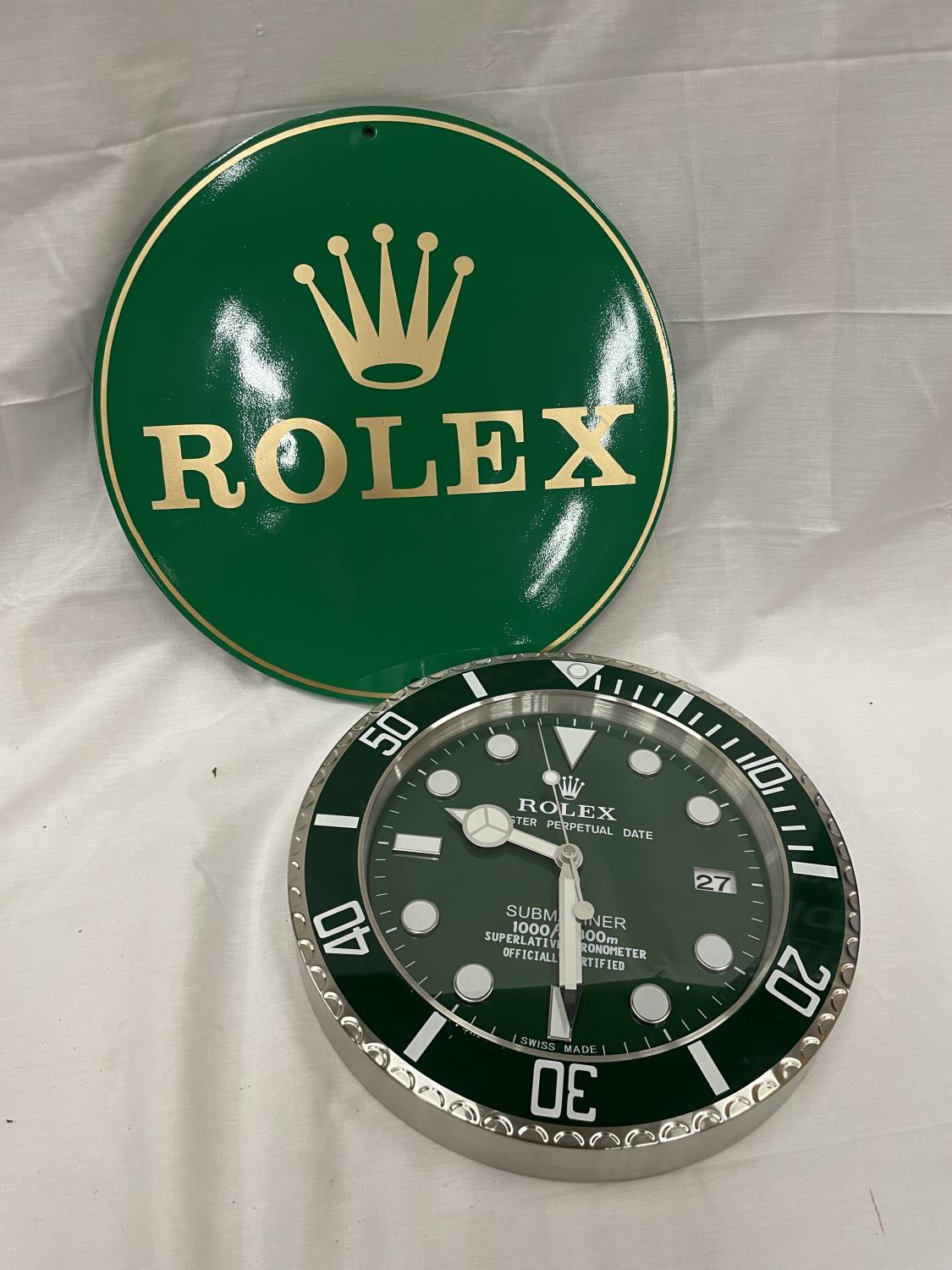 A DEALERS WALL CLOCK AND SIGN CLOCK DIAMETER 34CM SIGN 40CM