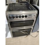 A SILVER HOTPOINT ELECTRIC OVEN AND HOB