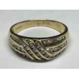 A 9 CARAT GOLD RING MARKED 375 WITH CUBIC ZIRCONIA IN A SWIRL DESIGN SIZE T GROSS WEIGHT 4.3 GRAMS